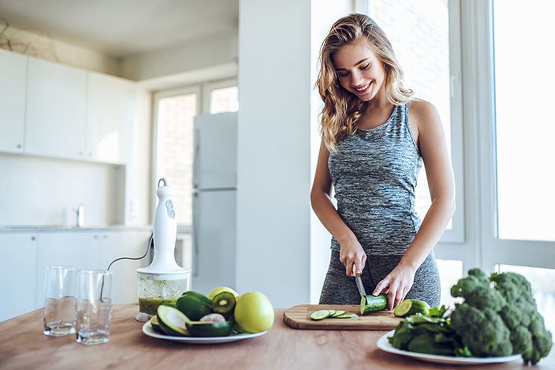 The girl prepares a healthy diet after calculating the daily calorie intake. 